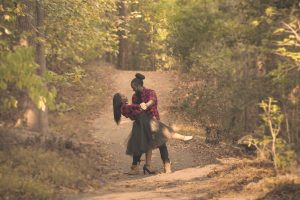 two love birds dance in a forest much like Nasiebanda nende Mwibanda