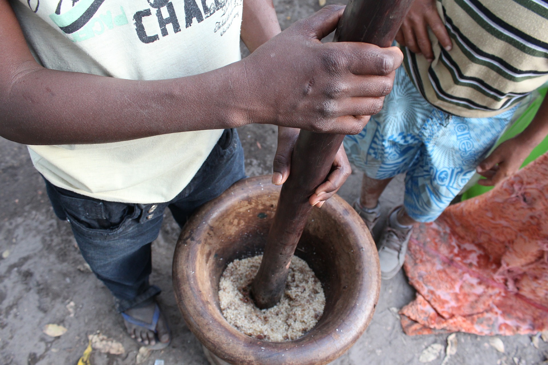 pounding grain using mortar and pestle