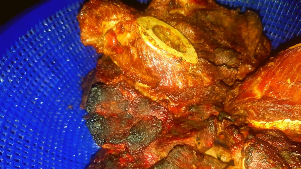 ready aged beef the luhya way in a blue plastic kitchen strain