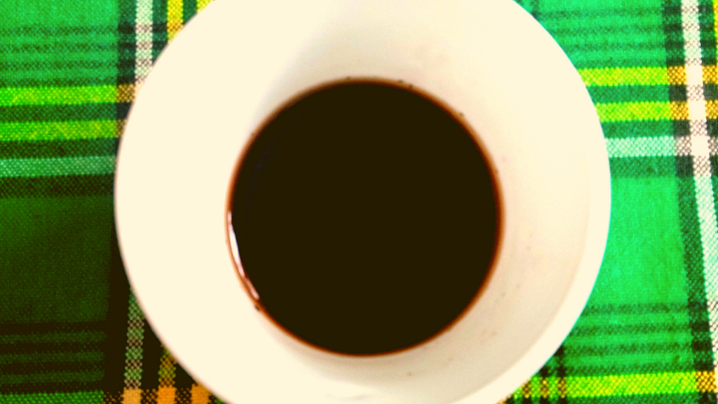 dark munyu in a white cup