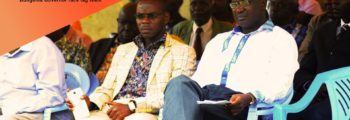 Kubende Wa'wekhomba sitting next to Wycliffe Wangamati at an event during the 2017 Bungoma county governor campaigns
