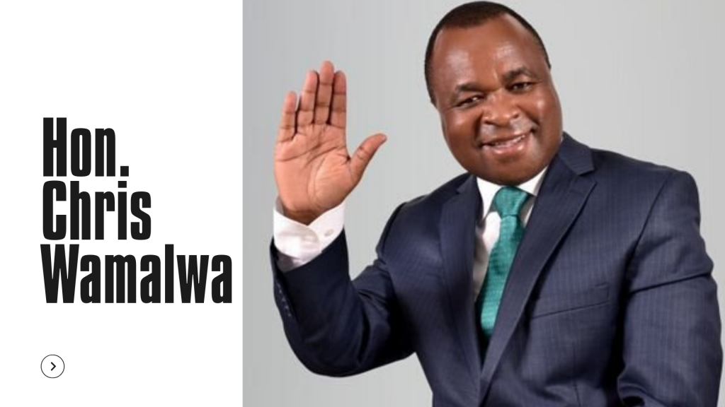 A smiling and waving Chris Wamalwa