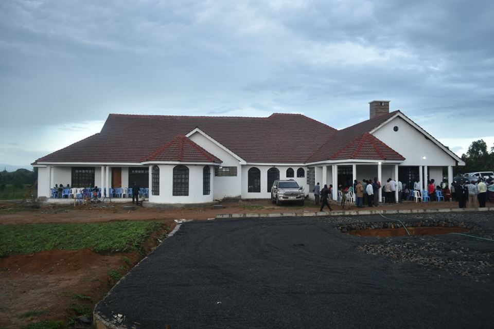 Governor Wycliffe Wafula Wangamati\'s single story white walled home designed with a massive parking lot upfront and begetting a middle court