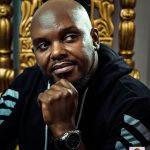 Potrait of Hubert Nakitare aka Nonini Mgenge in which he posses holding his chin, head tilted to the right and looking into the distance