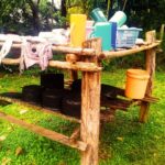 picture of outdoor wooden rack with utensils kitaraze or ikitaraze in maragoli language also known as shitalasi in isukha, shitalalataliro in wanga, sirandaro in bukusu