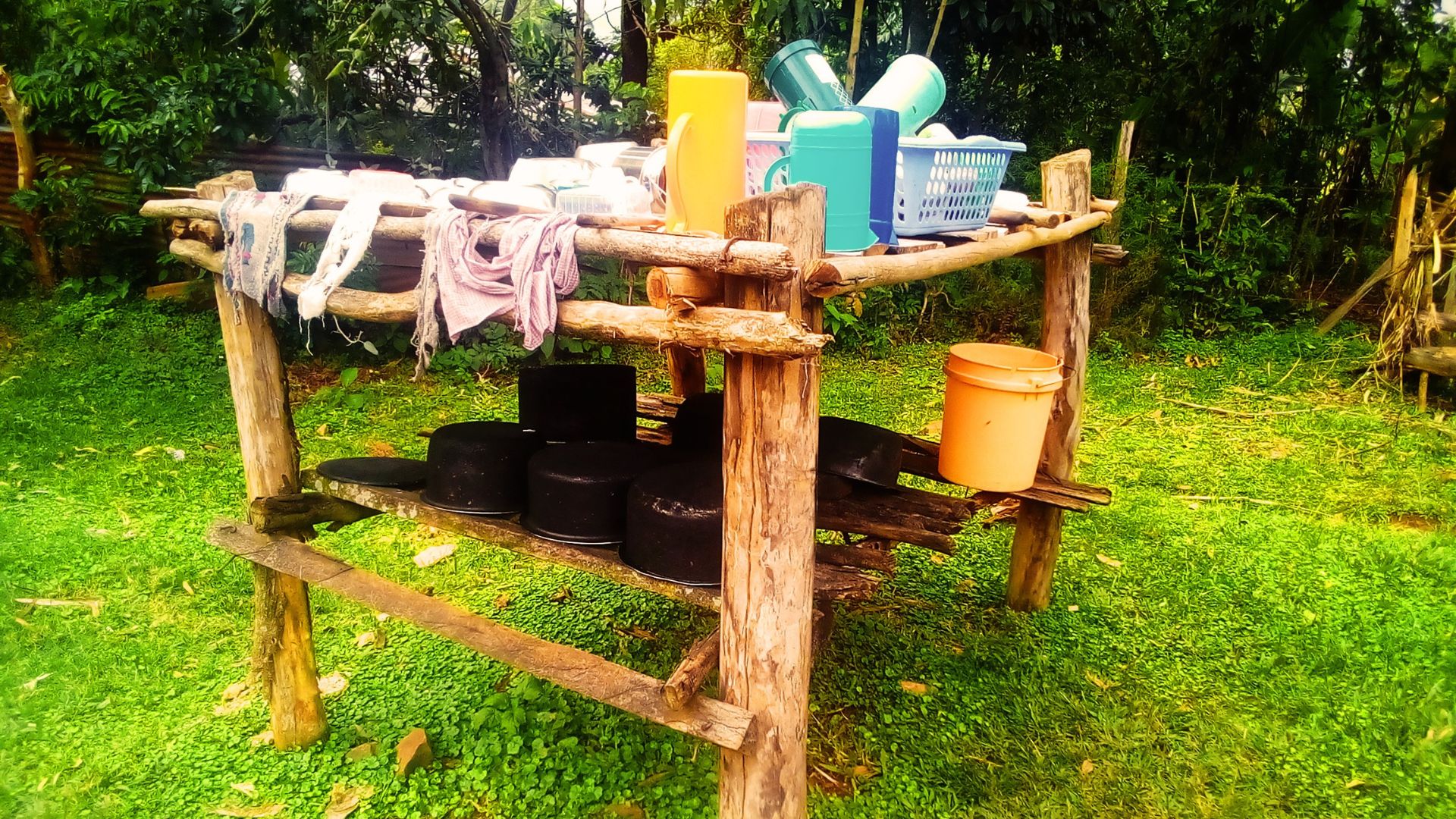 picture of outdoor wooden rack with utensils kitaraze or ikitaraze in maragoli language also known as shitalasi in isukha, shitalalataliro in wanga, sirandaro in bukusu
